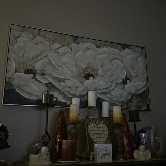 the whole set up for sale candles little signs and the big flower picture.